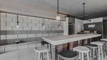 Enjoy a drink at the bar with comfortable seating for all.