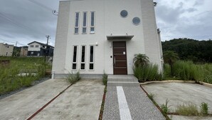 A modern two-story building with a flat roof, large windows, and a central door. - shirahamakashibesso ss2-76 (Shirahama)