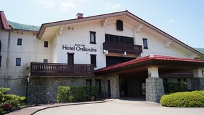 A two-story building with a sign reading "Hotel Orikoube" and a stone facade. - Hotel Onikoube (Osaki)