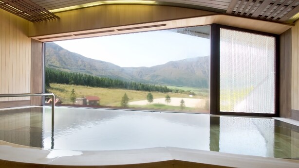 A spa area with a large window offering a view of a mountainous landscape. - Hotel Onikoube (Osaki)