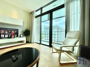 Standard Apartment | Living area | 40-inch LED TV with digital channels, TV, Netflix - Homesuite’ Home @ Riverson SOHO (Kota Kinabalu)