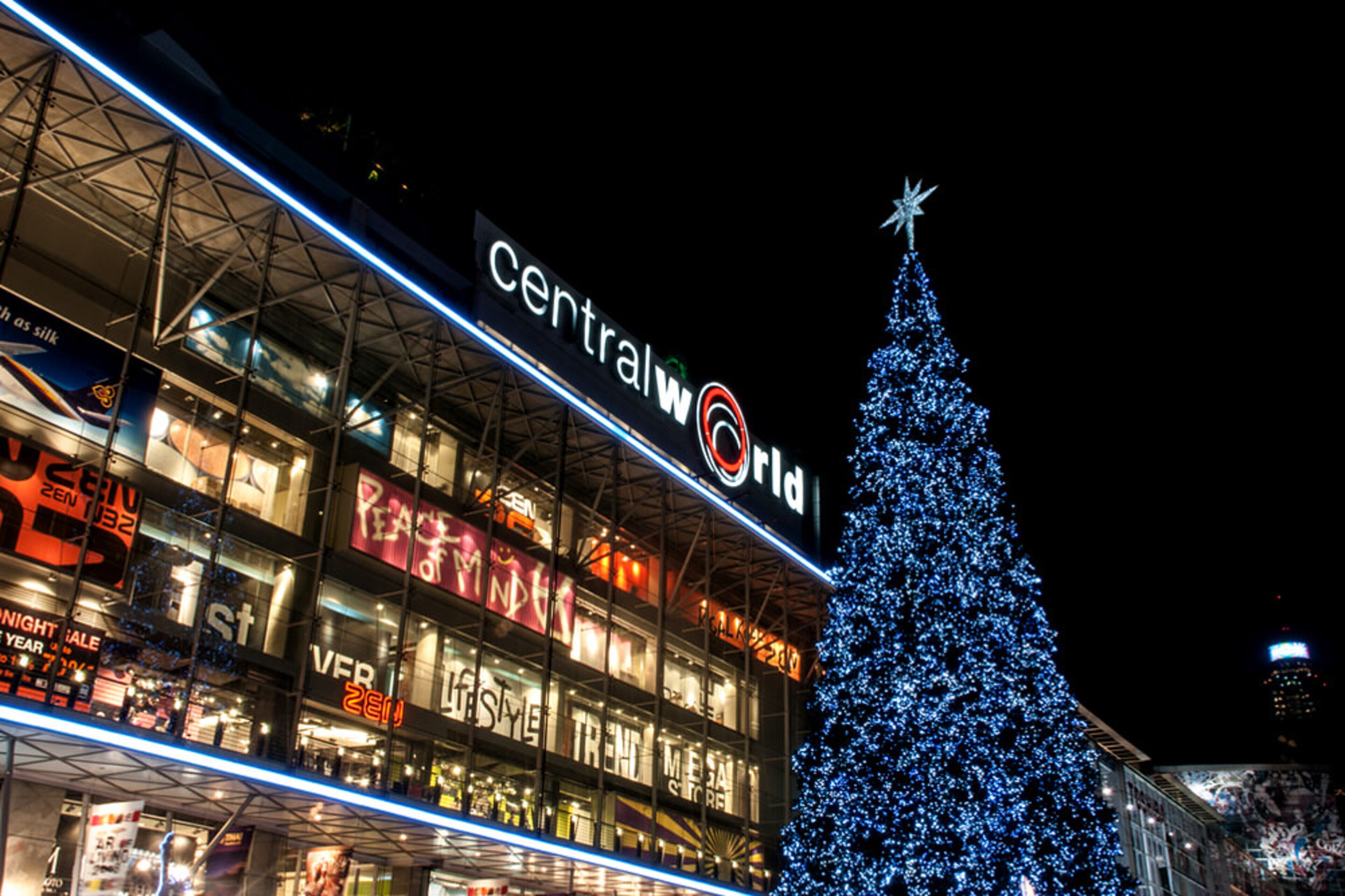 A building with a large Christmas tree and the sign "Central World".