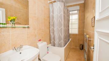 Combined shower/tub, towels, soap, shampoo