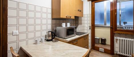 Apartment (1 Bedroom) | Private kitchen | Microwave, electric kettle, toaster, dining tables