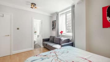1 bedroom, desk, iron/ironing board, travel crib