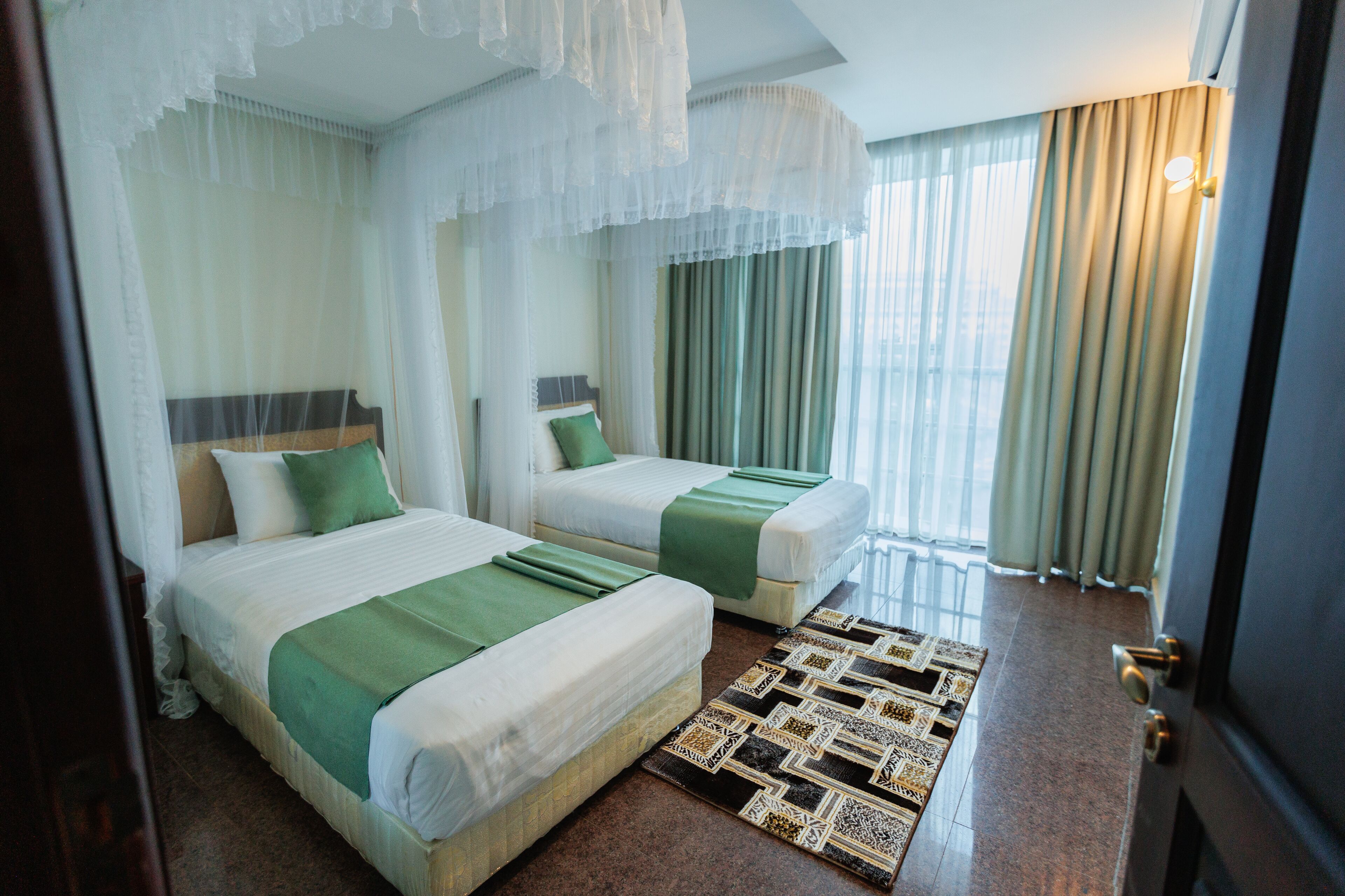 Premium bedding, desk, laptop workspace, soundproofing