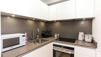 Departamento urbano, baño privado | Cocina privada