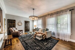 Smart TV - Open-concept 1BR condo with bright living, dining, and kitchen areas. Features a 65″ HDTV, Alexa for easy entertainment, and a spa-style ensuite bath for ultimate relaxation—perfect for a refined Dallas stay. (Dallas)