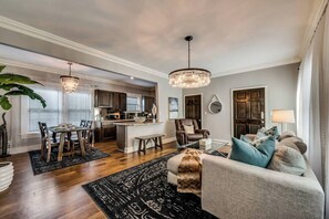 Smart TV - Open-concept 1BR condo with bright living, dining, and kitchen areas. Features a 65″ HDTV, Alexa for easy entertainment, and a spa-style ensuite bath for ultimate relaxation—perfect for a refined Dallas stay. (Dallas)