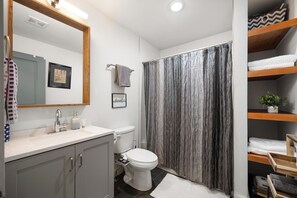 Combined shower/tub, hair dryer, towels, soap