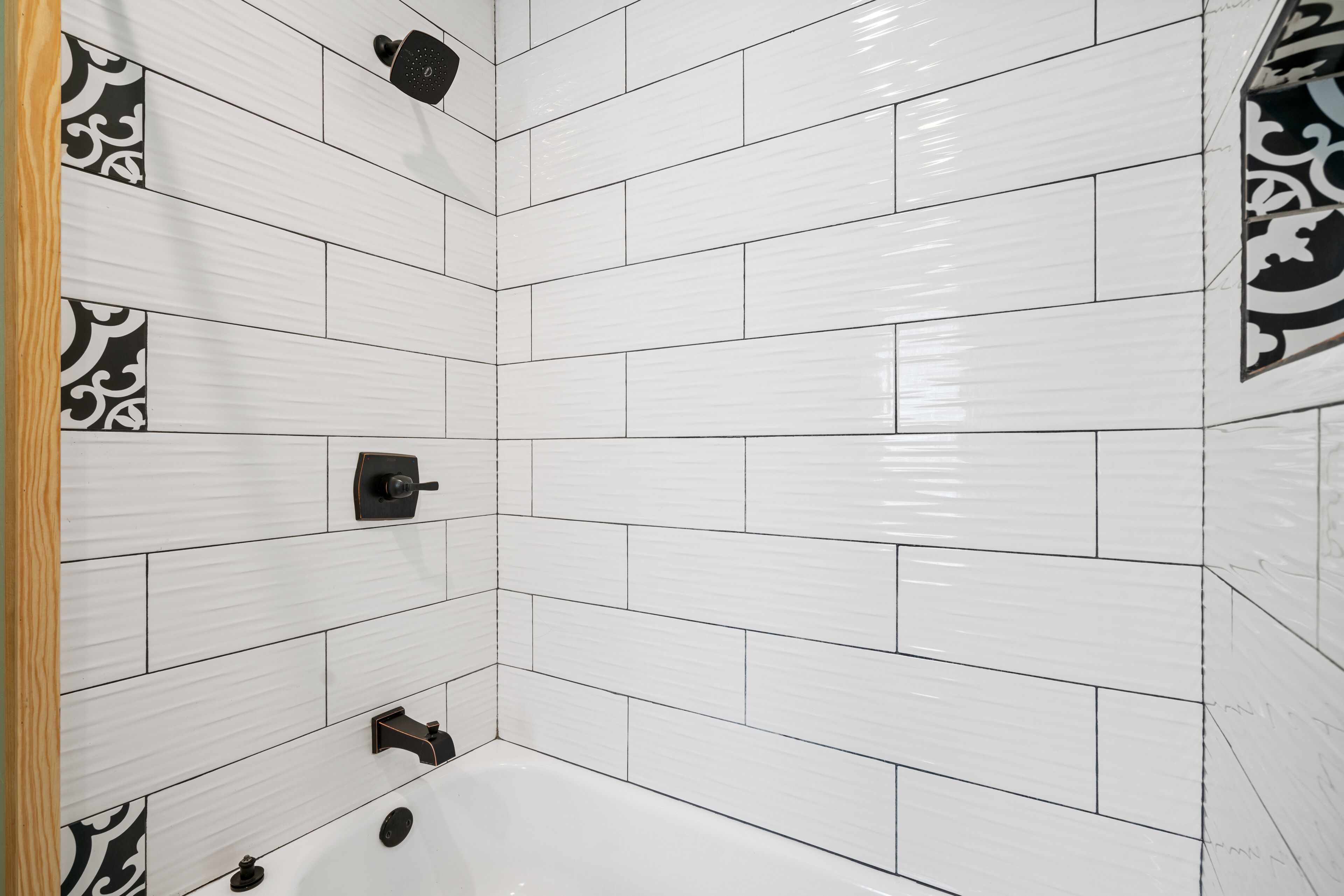 Combined shower/bathtub, towels, soap, toilet paper