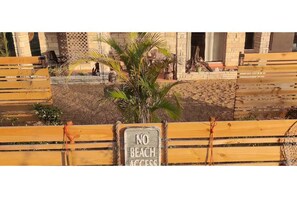 Enjoy a tranquil seating area amidst lush landscaping.