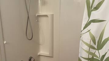 Combined shower/tub, hair dryer, towels, soap