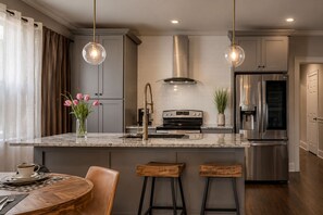 Coffee/tea maker, fridge, microwave, oven