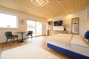 Deluxe Double Room | Living area | Flat-screen TV