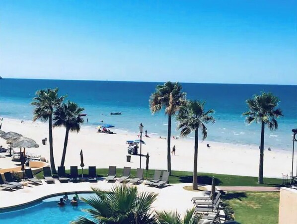 On the beach, sun loungers, beach towels