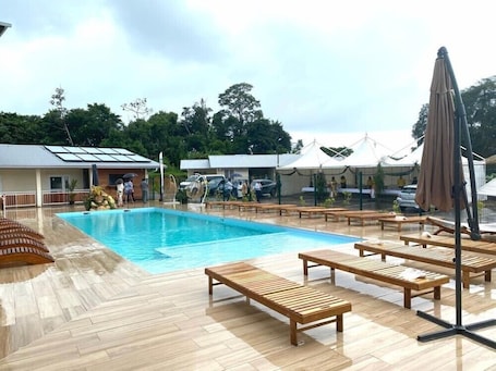 Outdoor pool, pool umbrellas, sun loungers