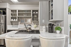 Fridge, microwave, oven, stovetop - Modern & Stylish 2BR/1BA loft in Dallas’ Historic Deep Ellum/Junius Heights District. Features king & queen beds, private balcony, and access to an offsite award-winning courtyard retreat. (Dallas)