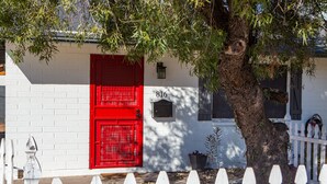 A white house with a red door, number 816, and a white picket fence. - Quaint Central Phoenix Duplex   (Phoenix)