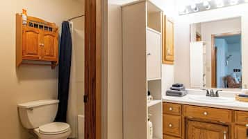 Bathtub, hair dryer, towels, soap
