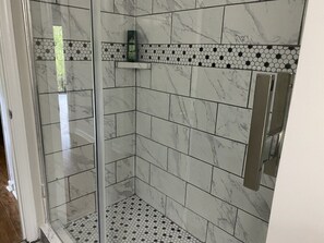 Shower, towels, soap, toilet paper