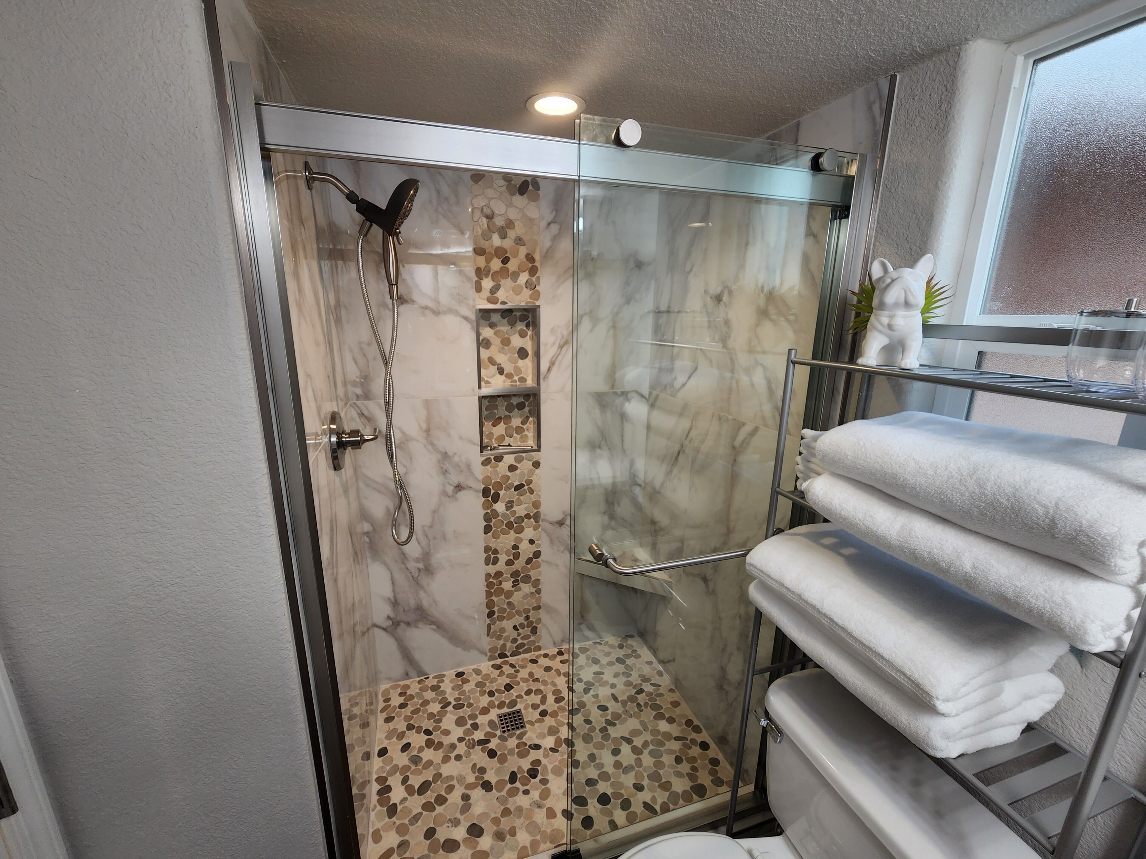 Shower, hair dryer, towels, soap