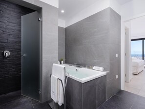 Bathtub, jetted tub, hair dryer, towels