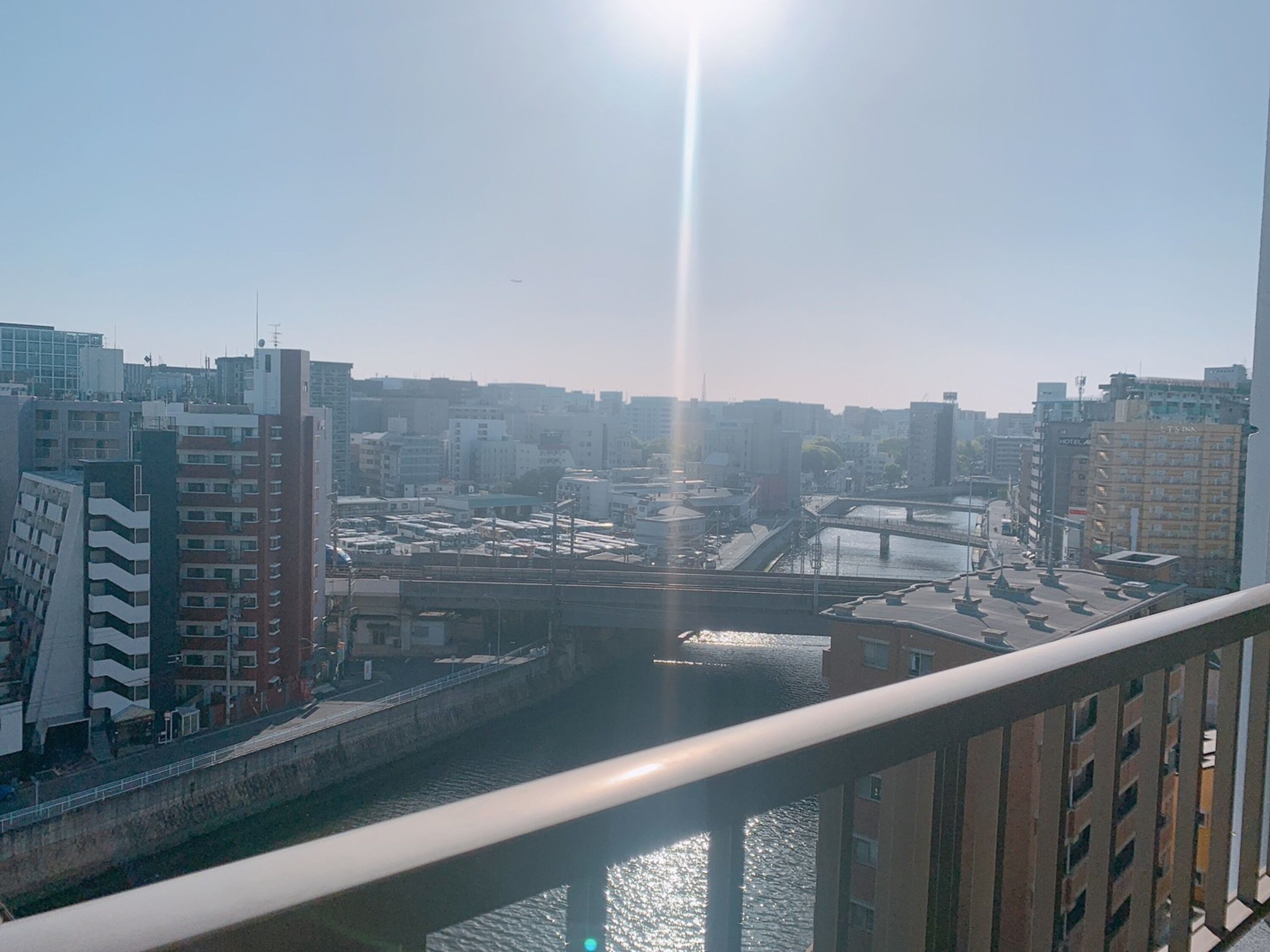 A cityscape with a river, bridges, and buildings.