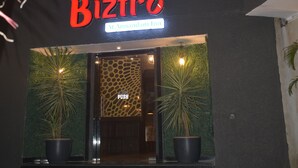 A building with a sign reading "Bistro at Annandam Inn". - Annandam Inn-Hotel Anand (Seoni)