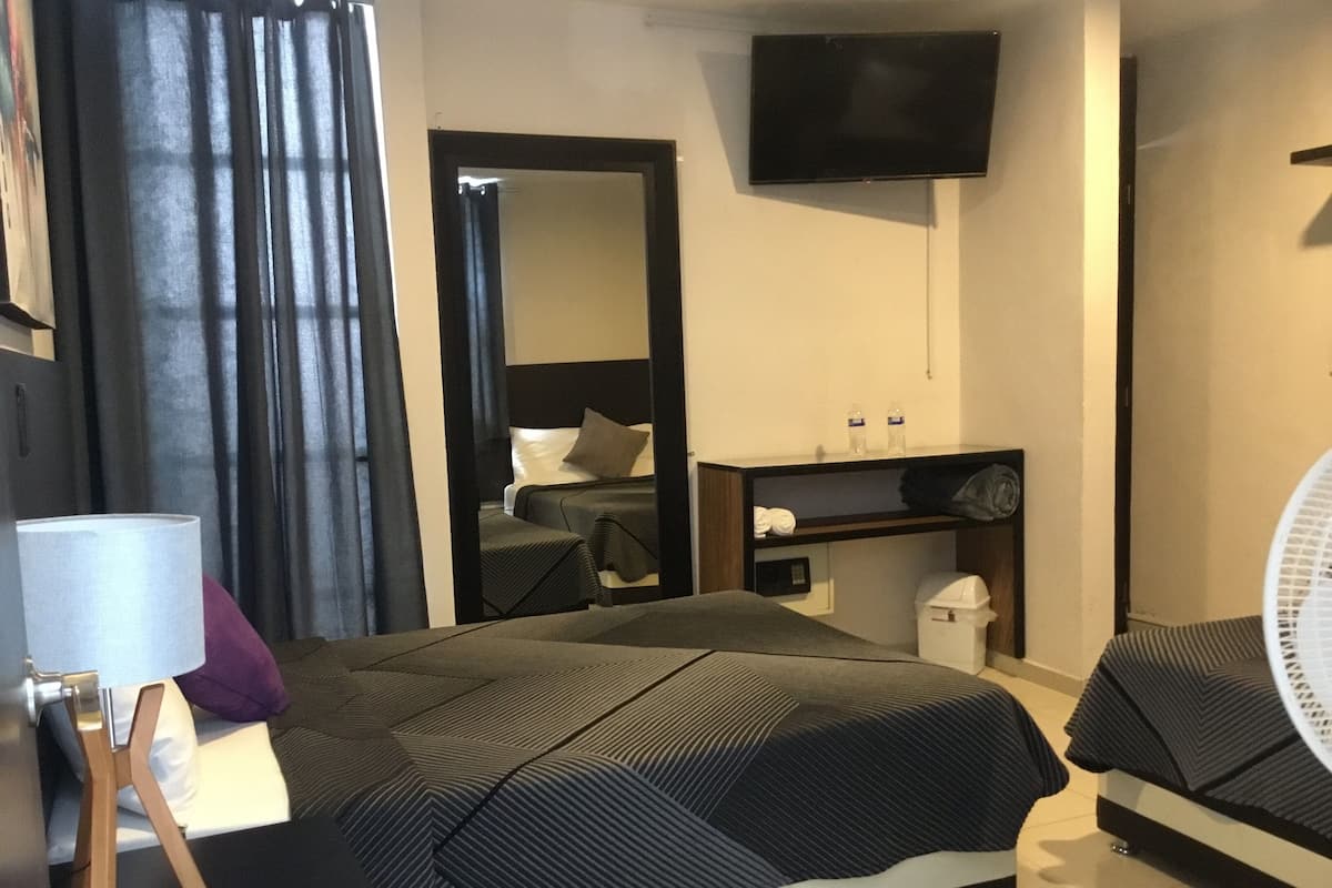 Comfort Quadruple Room (#7) | In-room safe, WiFi (free), bed sheets