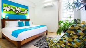 A hotel room with a bed, a ceiling fan, an air conditioning unit, a window with curtains, and a potted plant. - Amazing Villa El Sueno 3 (Puerto Vallarta)