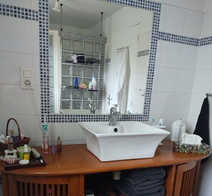 Shower, hair dryer, towels, toilet paper