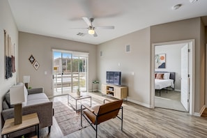 Deluxe Apartment, 2 Bedrooms | Living area | 42-inch TV with digital channels