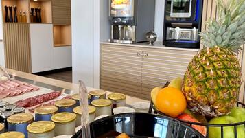 A kitchen counter with a bowl of fruit soup, a pineapple, and various condiments.