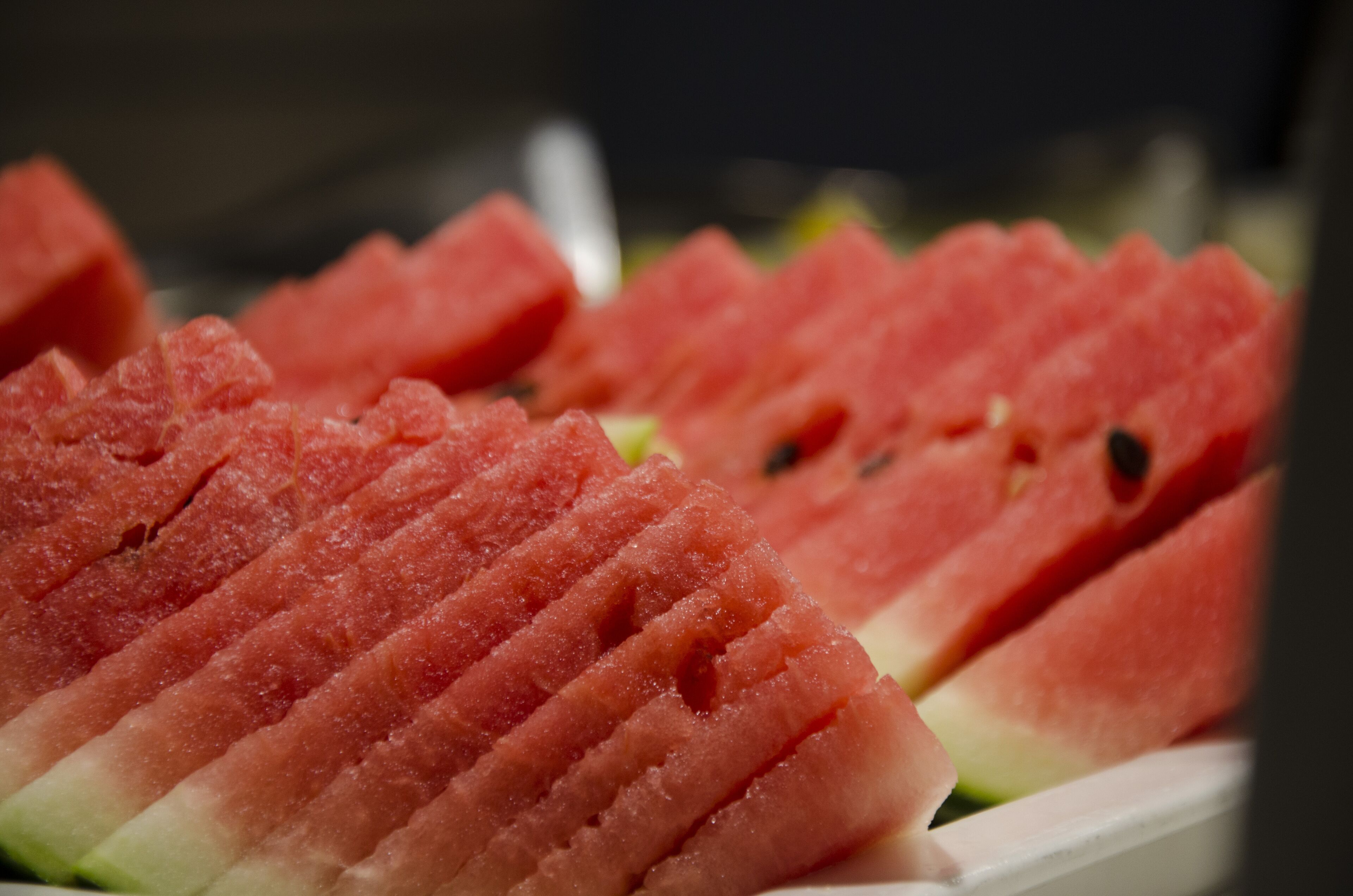 A close-up of watermelon slices arranged on a tray.