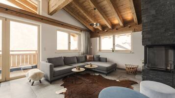 Penthouse | Living area | 32-inch TV with cable channels