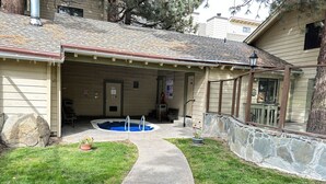 A house with a swimming pool, a stone wall, and a pathway leading to the entrance. - La Vista Blanc #59 1 Bedroom Condo by RedAwning (Mammoth Lakes)
