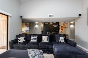 Relax in style with a comfortable sofa and stylish seating area.