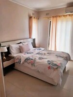 Standard Apartment | Minibar, in-room safe, individually decorated, individually furnished