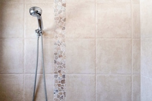 Shower, hair dryer, towels, shampoo