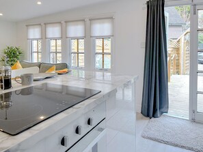 Private kitchen - Elegantly finished lodge with a private, decked garden. (Ashbourne)