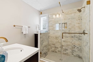 Combined shower/tub, hair dryer, towels, soap