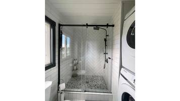 Shower, hair dryer, towels, soap
