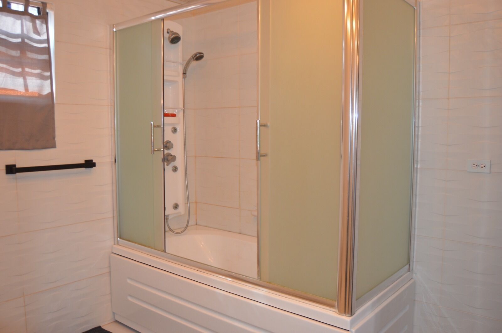 Combined shower/tub, hair dryer, towels, soap