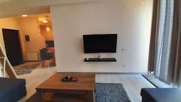 Appartement Confort | Coin séjour | Télévision à écran plat