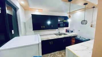 Fridge, microwave, cookware/dishes/utensils