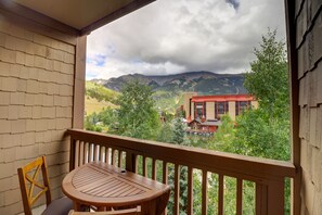 Enjoy breathtaking views of the surrounding mountains and lake from this balcony.