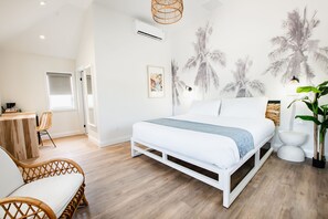 Deluxe Room, 1 King Bed | In-room safe, individually decorated, iron/ironing board, free WiFi