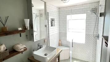 Shower, hair dryer, towels, soap