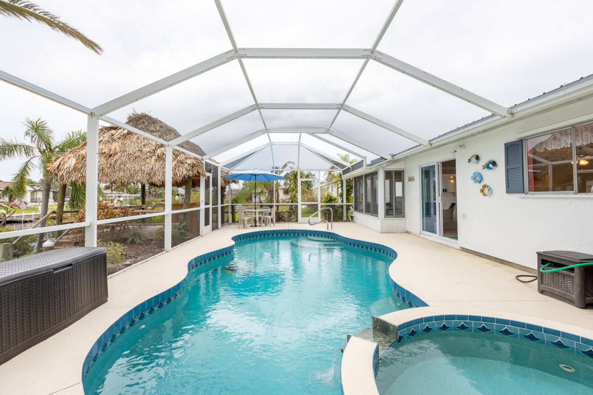Waterfront, Tropical Home with TIKI HUT! Access to Charlotte Harbor, Pool with Hot tub